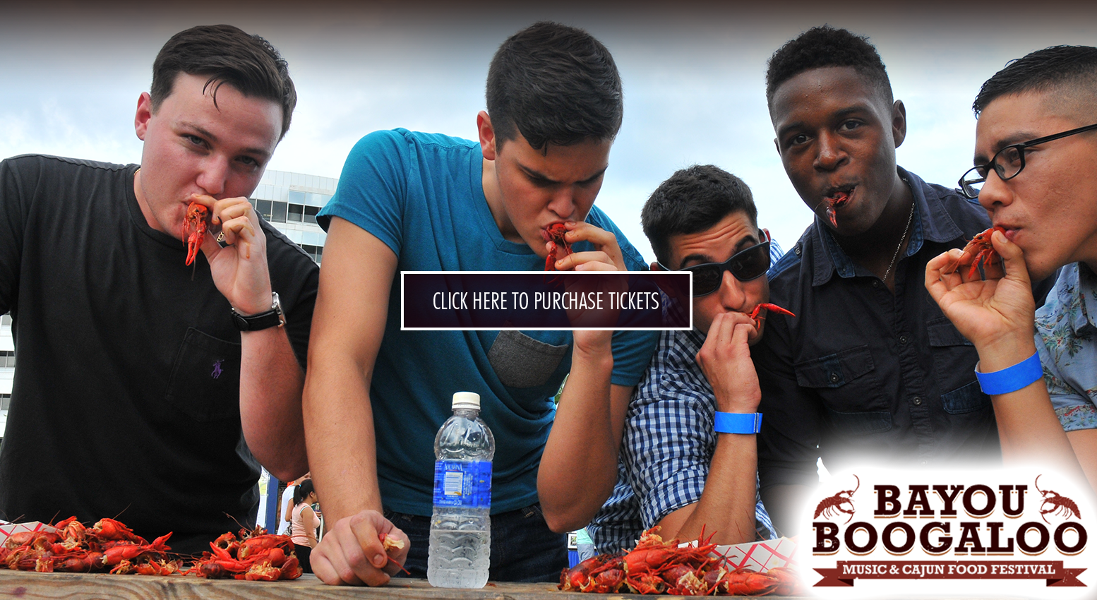 young men eating cajun shrimps